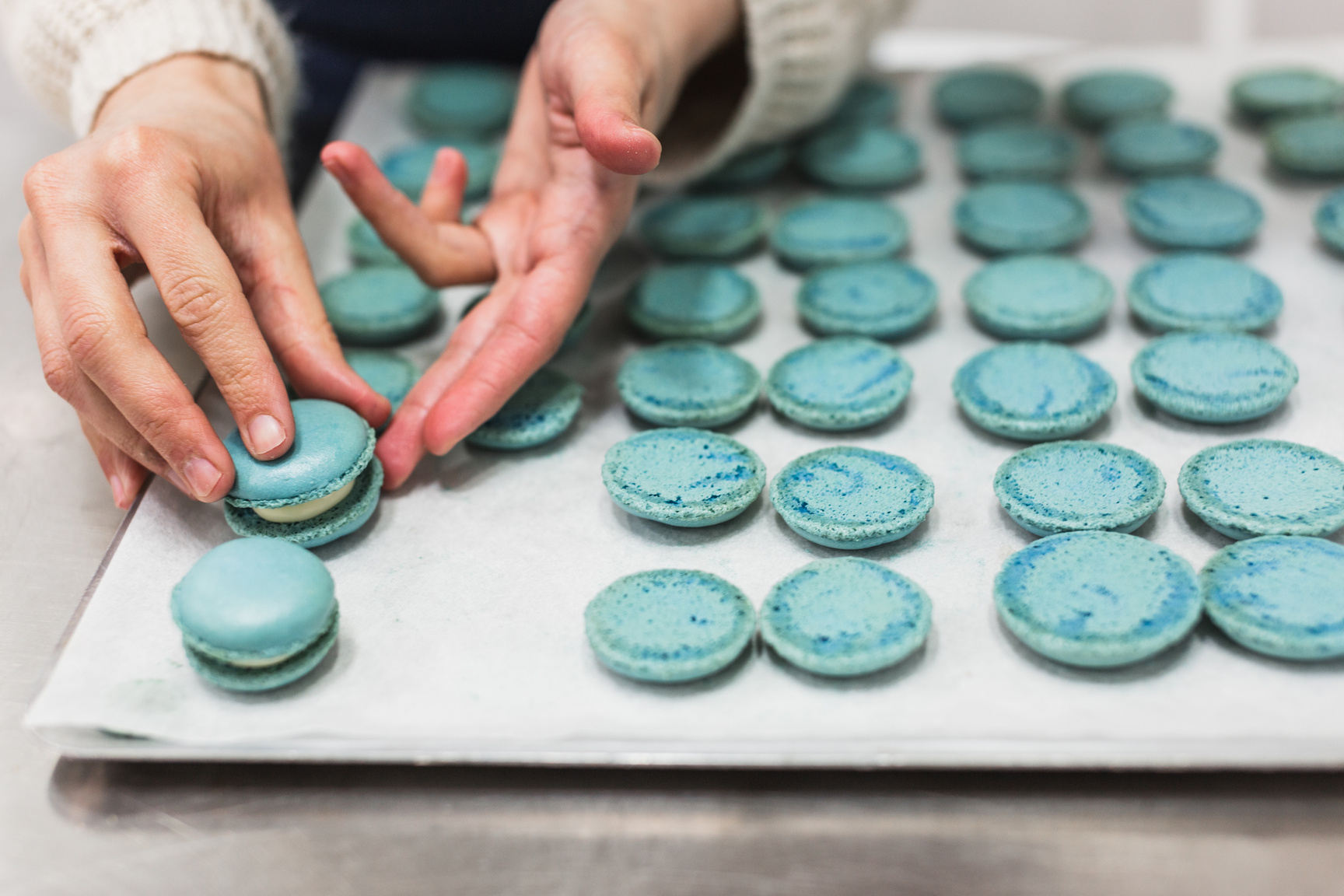 Pastry Chef Making Macarons in Pastry Shop